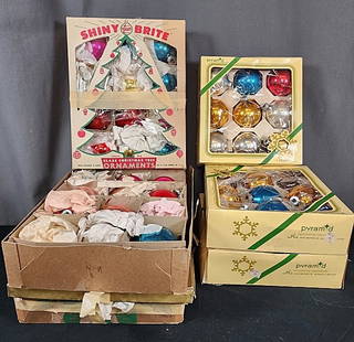 6 Boxes of Vintage Christmas Ornaments: 6 Boxes of Vintage Christmas Ornaments. Group includes 6 boxes of vintage glass ball ornaments. 3 boxes by Pyramid with 25 ornaments in red, blue, green, gold, and silver, 2 are flocked saying "Season
