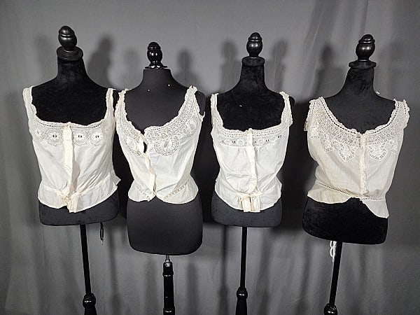 Group of 4 Antique Victorian Fine Cotton Corset Covers c1880: Group of 4 Antique Victorian Cotton Corset Covers c1880. The group includes 1 fine cotton antique corset cover featuring lace straps and upper bust in an arrow like pattern, eyelet lace, and mother of