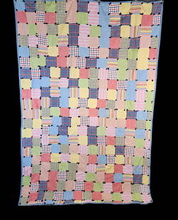 Vintage c1940s One Patch Comfort Quilt: Vintage c1940s One Patch Comfort Quilt Measuring 68 x 102 inches. It is comprised of squares about 5x5 inches in a variety of plaids, stripes, solids, and chambrays. It is machine pieced and hand tied