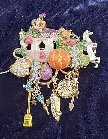 Kirks Folly Cinderella's Carriage Brooch: Kirk's Folly Cinderella's Carriage Brooch. This cute gold tone brooch by Kirk's Folly features Cinderella's carriage pulled by two white horses and a slew of charms and animals tucked in throughout. S