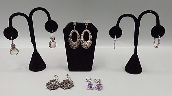 Group of Sterling Earrings-Judith Ripka and More: Group of sterling Earring-Judith Ripka and More. The group includes 1 pair of sterling hook earrings with bezel set amethysts and disc pearls. Stamped 925. They measure 1.5'' long by .5'' wide. In goo