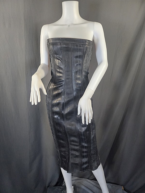 Black Rubber Fetish Corset Dress: Y2K Black Rubber Fetish Corset Dress by Gaelyn and Cianfarani. Corset laces up the back and has a side zipper. Baby blue parachute like material in the back under the lacing. 36" long from top of bust