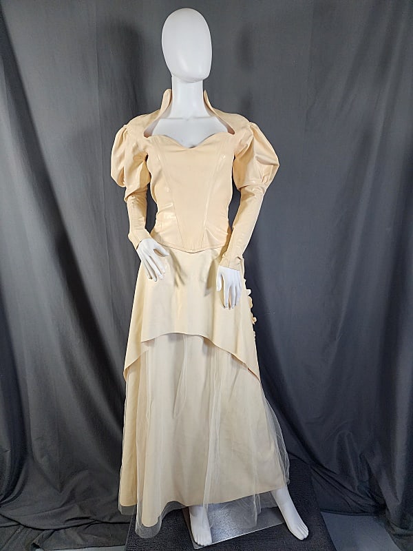 Ivory Latex 2 Piece Wedding Dress: Ivory Latex 2 Piece Wedding Dress from 2003 by Gaelyn and Cianfarani. Top has a puffy sleeve and is snug on the forearms. It zippers in the back, as well as laces. Skirt has a latex underskirt, and a 
