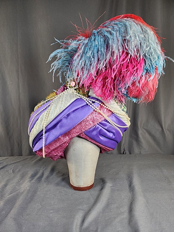 Vintage Gary Brouwer Costume Turban: Large vintage costume turban with layers or lame and satin and embellished with paste jewels, faux pearls and colorful feathers. This is by the famous milliner Gary Brouwer. Gary Brouwer, the Dutch-bo