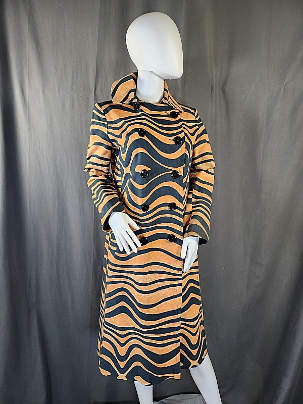 Vintage Tiger Print Coat-La Flaque de Paris: Vintage c1960s canvas tiger print coat by La Flaque de Paris. Double breasted black and gold cotton with side welt pockets, satin lining. Good condition with some soiling on left cuff ,as well as, oth