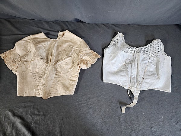 Antique Victorian Cotton Brassiere and Ivory Silk Bodice: Antique Victorian Cotton Brassiere and Ivory Silk Bodice. This pairing includes 1 white cotton corset cover/brassiere by H&W Sheathlyne. Featuring an eyelet design at the yoke and straps, 4 thin steel