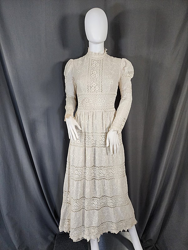 Vintage c1970 Lanz Original White Lace Prairie Dress: Vintage c1970 Lanz Original White Lace Prairie Dress. This vintage c1970 prairie style dress by Lanz Originals features a banded machine made lace overlay with floral motifs and an open weave. As well