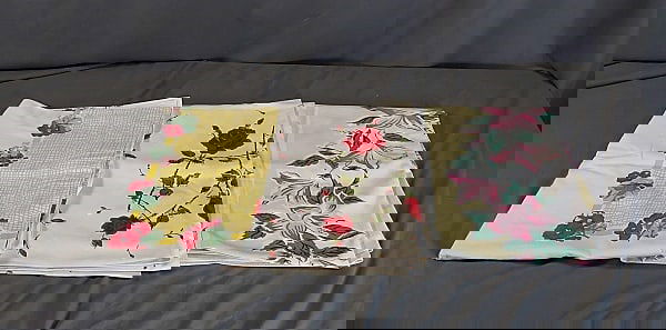 3 Vintage Printed Tablecloths-Flowers: Group includes white rayon blend with pink and red flowers with green leaves on yellow frame, measures 53"x63", several large spots. White cotton with red geraniums and green leaves on yellow lattice