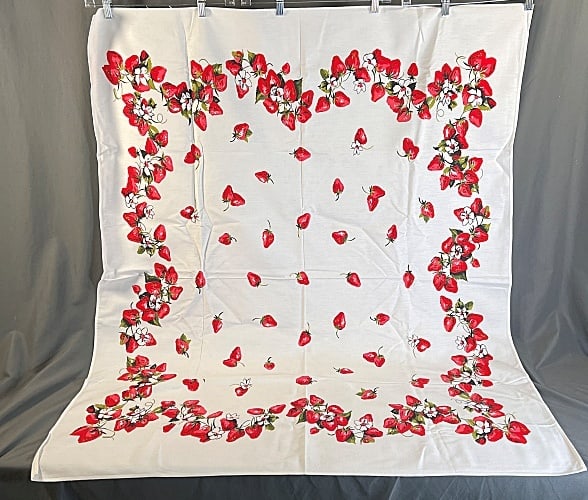 Vintage Printed Cotton Tablecloth - Strawberries: Vintage Printed Cotton Tablecloth - Strawberries. A white cotton tablecloth with a border of vibrant red strawberries and blossoms with single strawberries scattered in the center. measuring approxima