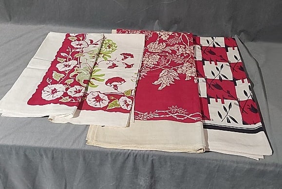 4 Vintage Printed Tablecloths - Flowers: 4 Vintage Printed Tablecloths - Flowers. Group includes red and green morning glory border, cotton, 40" x 48", good condition with small spots. A second red and green morning glory border, cotton, 38"