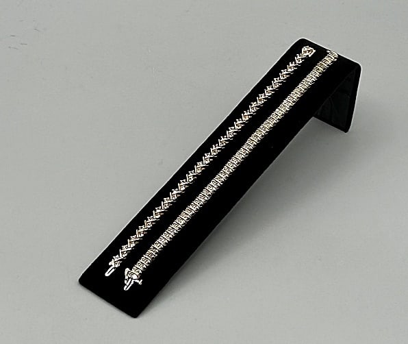 2 Gold and Diamond Tennis Bracelets: Pair of 14K Gold and Diamond Tennis Bracelets. The pairing includes 1, 14K yellow gold and diamond tennis bracelet in a zig zag style with channel and prong set 2-3mm round white diamonds and a tongue