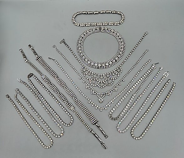 Large Group of 13 Vintage c1950 Rhinestone Necklaces: Large Group of 13 Vintage c1950 Rhinestone Necklaces. The group includes 13 vintage c1950 clear rhinestone necklaces/chokers ranging in length from 13'' long to 16'' long and ranging win width from 1/
