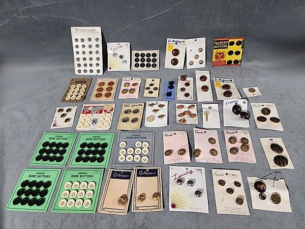 33 Vintage Carded Buttons-Metal, Wood, Leather, and Bone: Group of 33 Vintage Carded Buttons-Metal, Wood, Leather, and Bone. The group includes 33 vintage/antique c1880-1960. There is a mix of both complete and incomplete cards and some of the brands include
