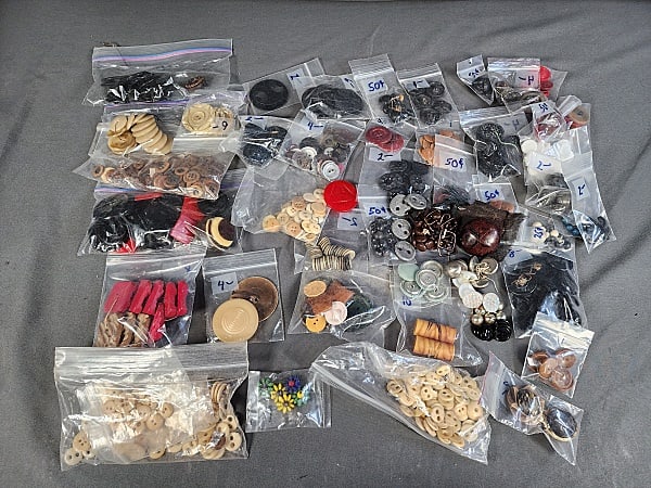 Large Group of Vintage Buttons- Bone, Metal, and More: Large Group of Vintage Buttons- Bone, Metal, and More. The group includes a wide array of vintage c1930-1950 in a mix of materials such as metal, bone, glass wood, leather, Bakelite, and plastic. The 