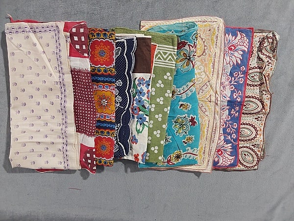 10 Vintage Handkerchiefs: Group of 10 Vintage Handkerchiefs. The group includes 10 vintage handkerchiefs featuring a variety of patterns and prints. They are mostly made of cotton but there is also 1 silk handkerchief and 2 po