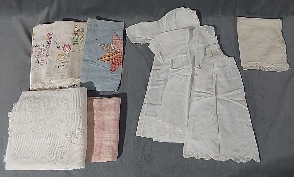 Group of Vintage c1950 Baby and Bedroom Items: Group of Vintage c1950 Baby and Bedroom Items. The group includes a mix of vintage c1950 baby and bedroom items. There are 3 hand made white cotton baby tops/dresses one of which is marked Santone, 2 