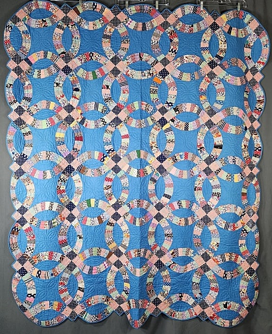 Vintage c1940 Double Wedding Ring Quilt - Blue: Vintage c1940s Double Wedding Ring Quilt - Blue. Measures 70" x 84", comprised of 30 interlocking rings 19.5" in diameter, set straight, 5x6. Each intersection has a 4 patch with a blue & white dot an