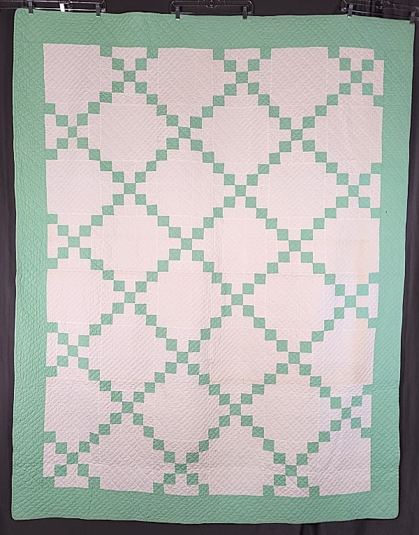 Vintage c1940 Single Irish Chain Quilt: Vintage c1940 Single Irish Chain Quilt measuring 68 by 88 inches. It is comprised of 48 squares, 9.5 by 9.5 inches, set straight, 6 by 8, with 24 pieced blocks and 24 solid alternating squares. There 