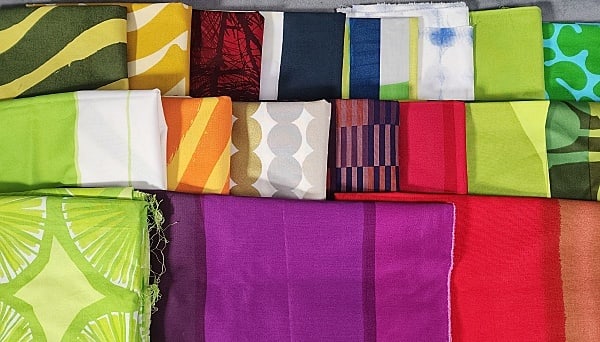 18 yards of Marimekko Fabrics: 10 lbs Vintage Marimekko Fabrics with 18 different prints are just over 18 yards of fabric total. All home decorator weight cotton fabric, a couple are sateen. From around 1999-2009. One piece may be