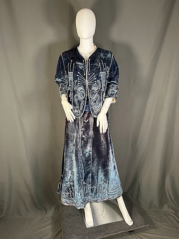 Late 19th Century Blue Velvet Day Dress: Late 19th Century Blue Velvet Day Dress. The pairing includes a late 19th century matching blue velvet bodice and skirt. The bolero-like bodice features three quarter length sleeves and a vest overlay