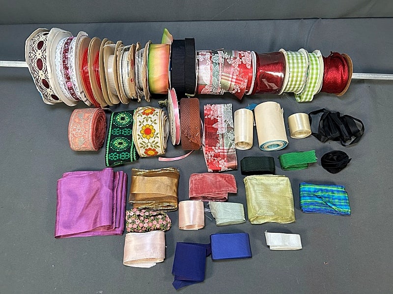 Group of Vintage Crafting Ribbon-Yardage: Group of Vintage Crafting Ribbon-Yardage. The group includes 17 rolls of antique and vintage ribbon with loose ribbons from the late 19th century to the 1990s. Featuring 7 yards of antique silver tone