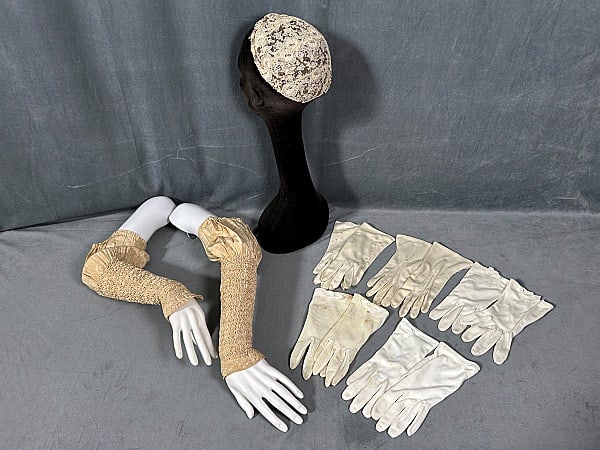 Group of Vintage Gloves and More: Group of Vintage Gloves and More. The group includes 1 pair of detachable heavily smocked 19th century silk sleeves featuring silk embroidery at the cuffs. In good condition with toning and a few spot