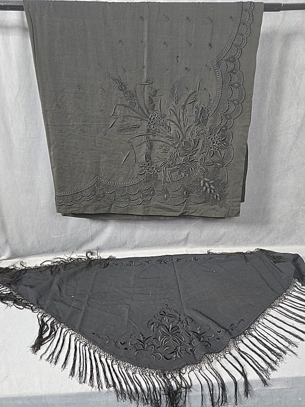 2 Late 19th Century Black Wool Shawls: 2 Late 19th Century Black Wool Shawls. The lot includes 1 late 19th century black wool shawl featuring a large embroidered corner set on point with a mix of beautifully executed black embroidery. The 