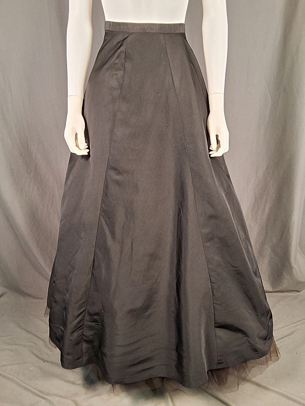 c1948 Black Satin Skirt and Petticoat: c1948 Black Satin Skirt and Petticoat. The lot includes 1 vintage black A line skirt (possibly by Mainbocher) and matching petticoat. The skirt is made of black acetate satin and has a high waist with