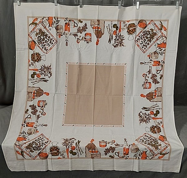 Vintage Printed Cotton Tablecloth - Ingredients: Vintage Printed Cotton Tablecloth - Ingredients. A white cotton tablecloth printed in orange, grey, beige, and green featuring ingredients such as veggies, spices and seasonings, measures 51"x 48", in
