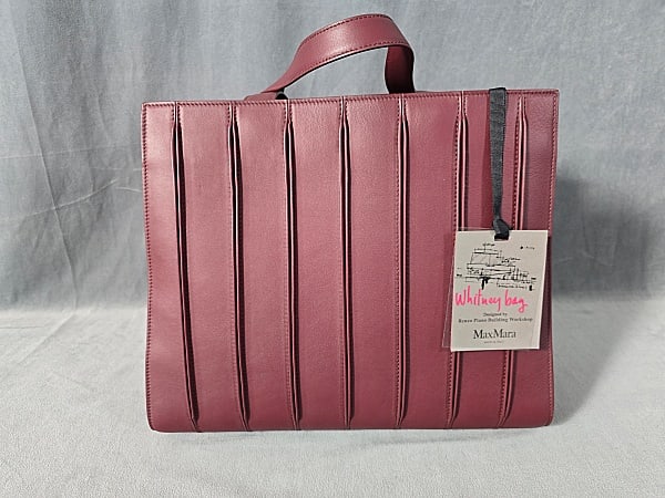 Max Mara Whitney Bag - Burgundy Leather: Max Mara Whitney Bag - Burgundy Leather, 14.5x12.5x6". Has original tag. Comes with cotton MaxMara dust cover bag and long shoulder strap. In very good condition, 2 minor rubs on the inside of handle.