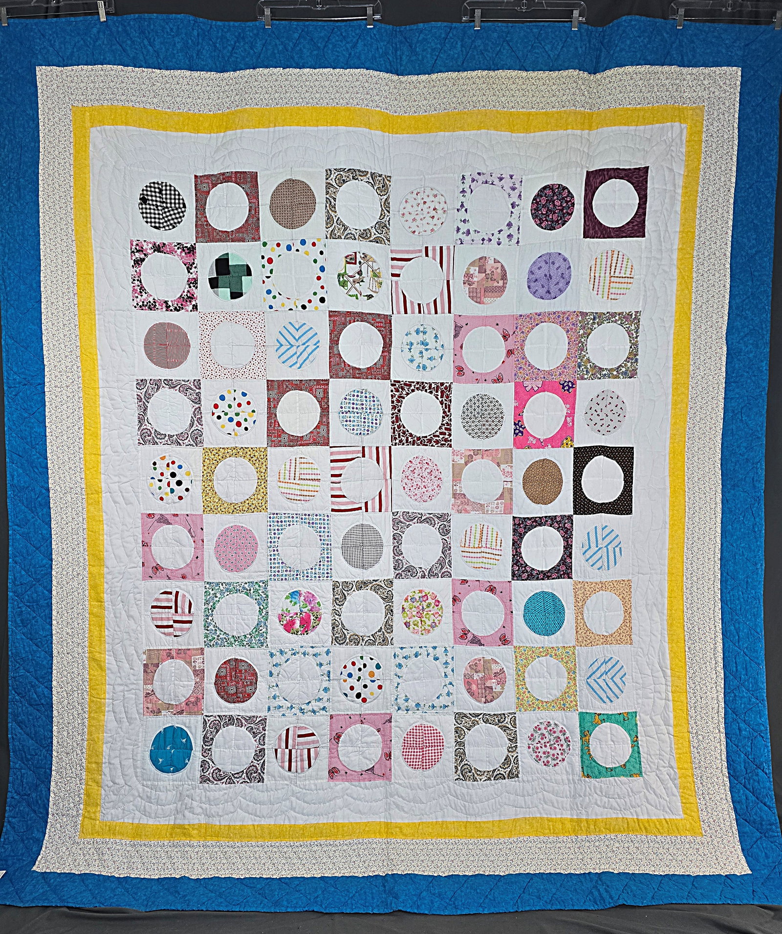 Modern Circle in a Square Quilt: Modern Circle in a Square Quilt, with blocks from about 1970-1980, and borders from about 2000. It measures about 90x102". It is comprised of 72 blocks, 7.5 by 7.5 inches, set straight, 8 by 9. There 
