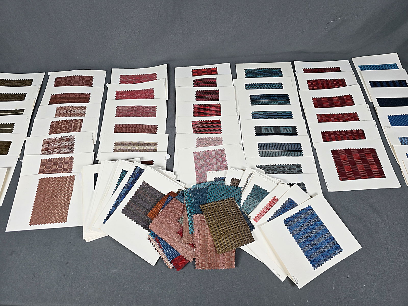 Vintage Auto Upholstery Loose Swatch Fabric Samples: Vintage Auto Upholstery Loose Swatch Fabric Samples. Includes 88 cards with samples, some cards with more than one sample mounted. And 52 loose samples. In overall good condition with glue residue. In