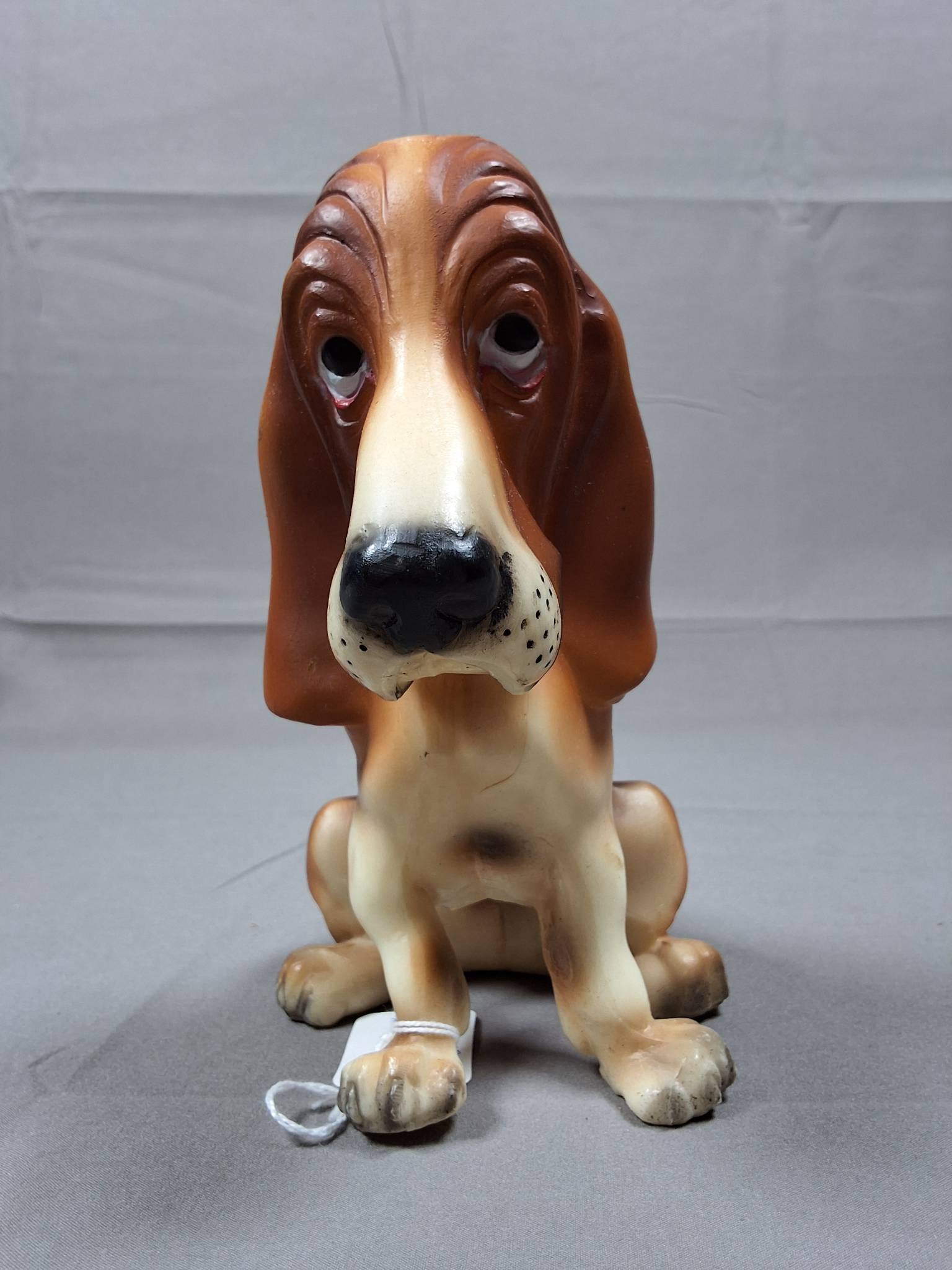 Breyer Jolly Cholly Bassett Hound #326 Signed: Breyer Jolly Cholly Bassett Hound #326 in original tricolor finish with a brown body, dark saddle, white muzzle, and belly. Painted eye whites add detail. The underside has two rubs, not visible when 