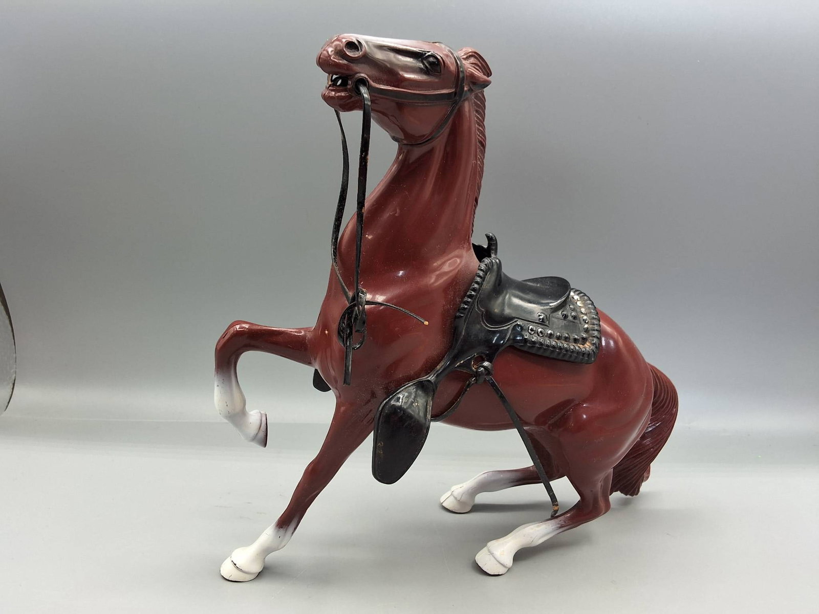 Hartland 800 Series Semi-Rearing Horse with Saddle - Cheyenne: Hartland 800 Series Semi-Rearing Horse in original reddish brown finish (Cheyenne?) with white blaze and stockings with black saddle and bridle. No rider. In fair condition with scratches and paint lo