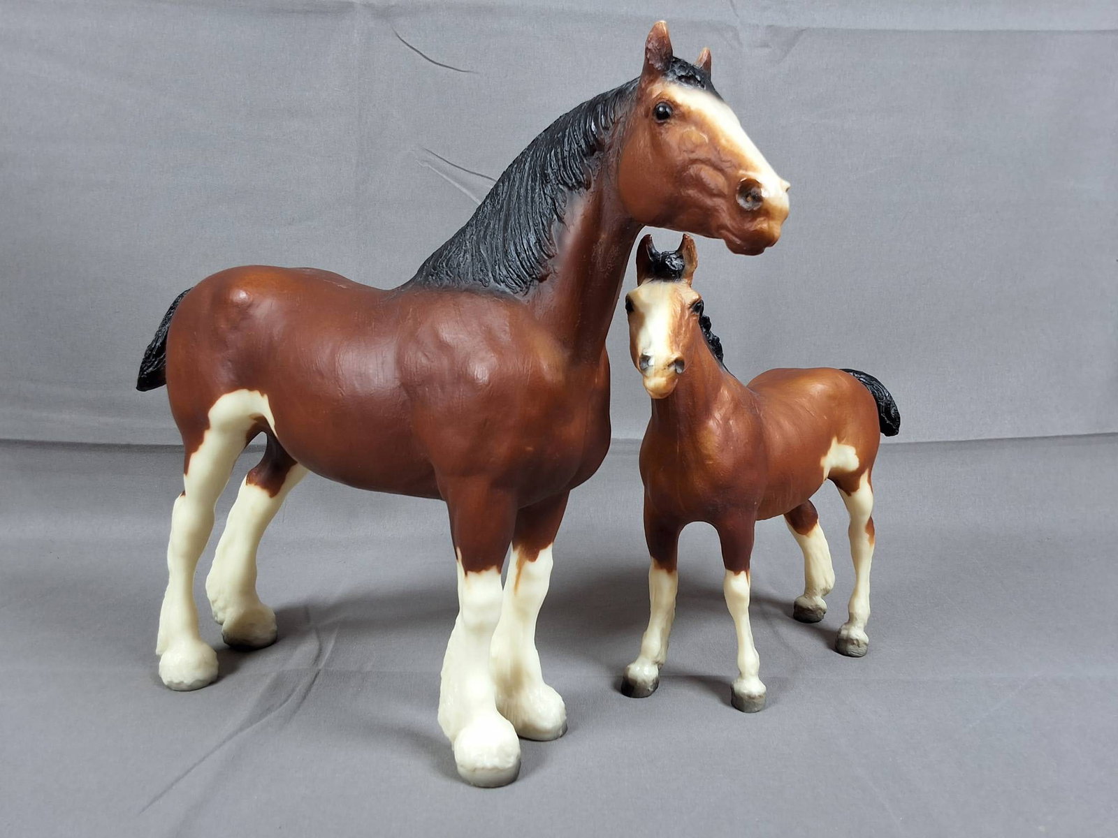Breyer #8034 Clydesdale Family Set 1983-1984 - Bay: Breyer #8034 Clydesdale Family Set consisting of a Clydesdale mare and foal, produced from 1983-1984 as part of the JCPenney Holiday Catalog. Both models feature a bay coloration with bald faces, blac