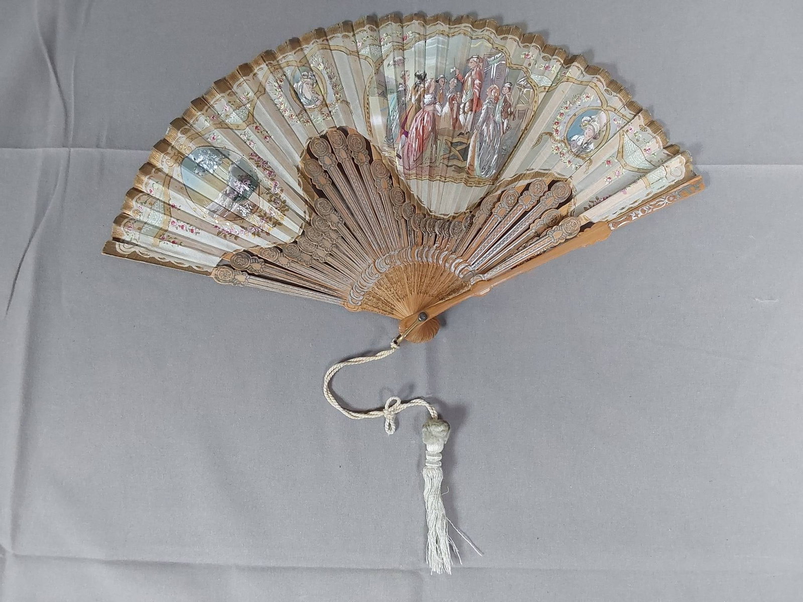 Antique Hand Painted Silk Folding Fan - Bamboo Guards: Antique hand painted silk organza fan with detailed medallions, garlands multi figure scenes, a unique undulating pattern and applied metallic gold accents and foil dots. Bamboo guards and ribs with a