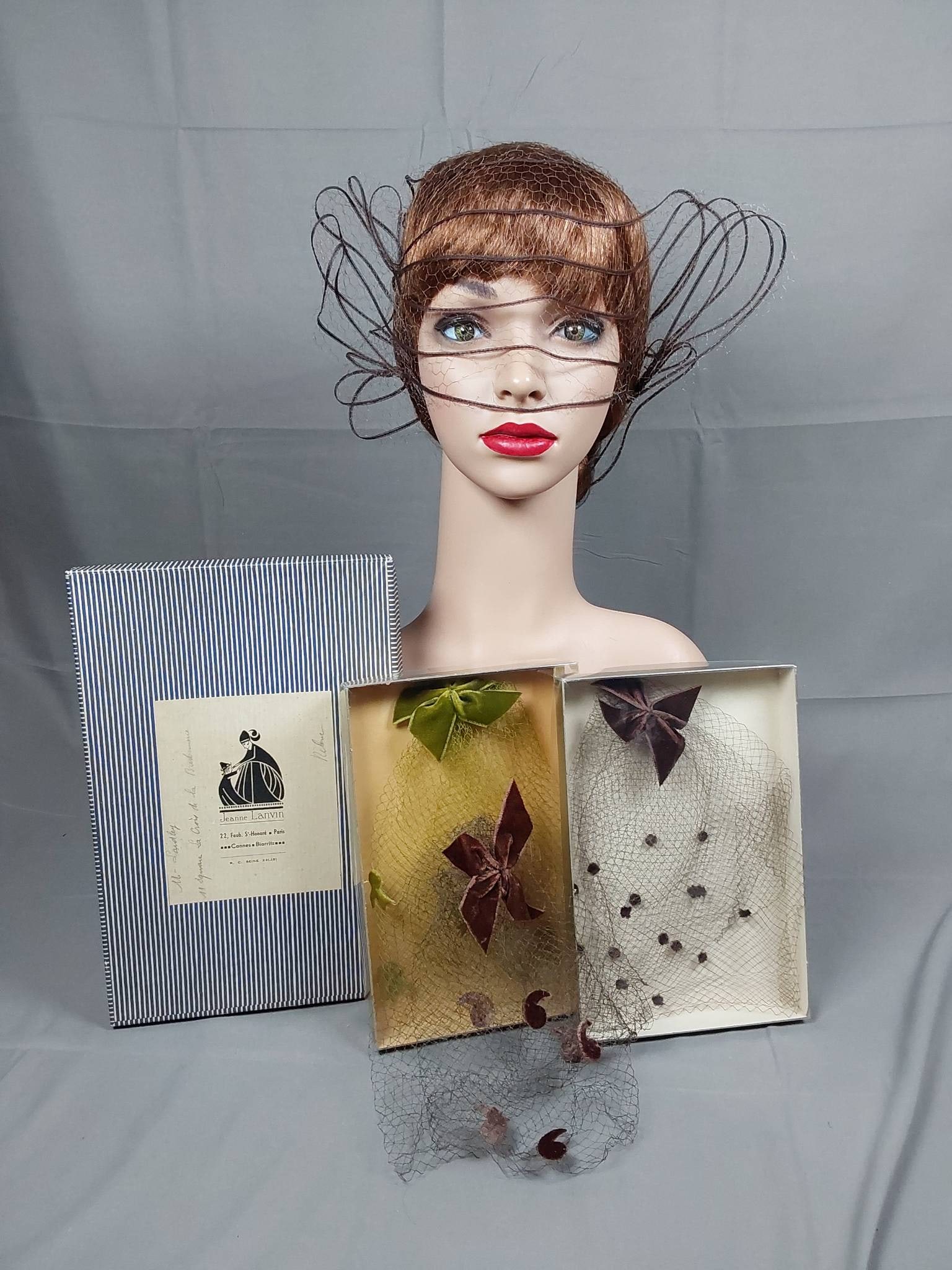 Lot of Three Vintage Illusion Veiled Hats: Lot of three vintage c1950-60 illusion net hats, each featuring unique designs. Includes a c1950 brown net hat with thin horsehair braid trim, featuring looped accents on the side, stored in a vintage