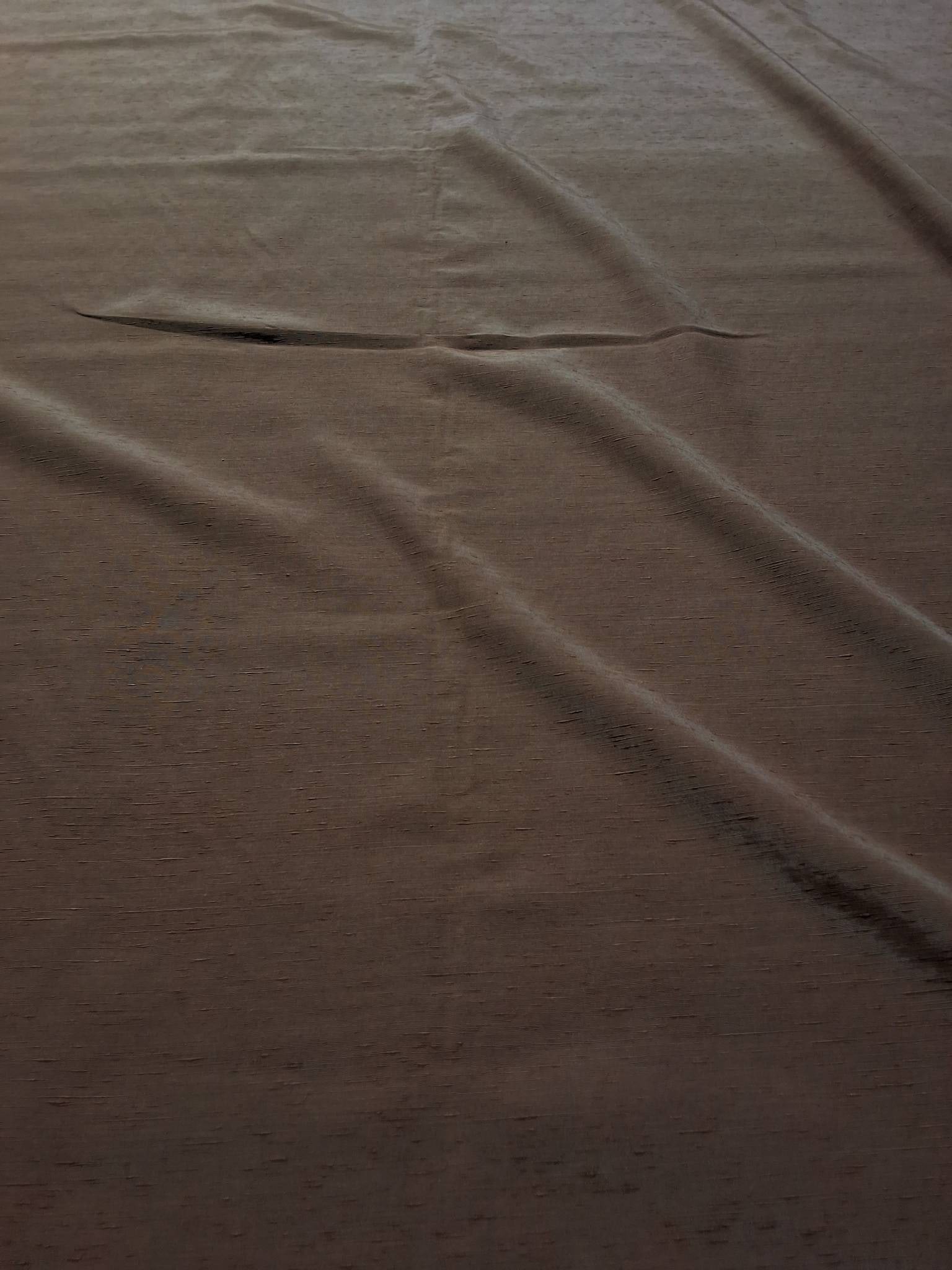 Vintage Fabric - Cedar Brown: Vintage cedar brown fabric measuring 44inx219in. The fabric has a slightly textured appearance and feel with a subtle sheen. In overall good condition, it shows some fading spots. Suitable for various