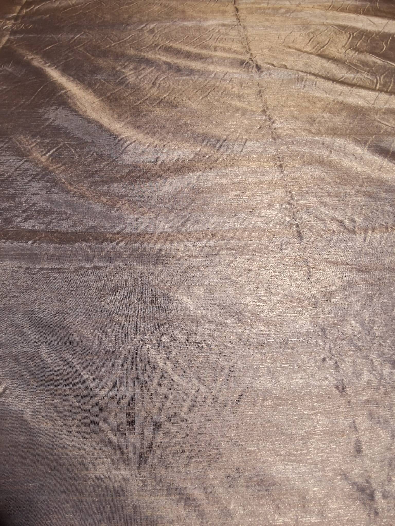 Vintage Fabric - Champagne Gold: A vintage sheer fabric in champagne gold with a slight sheen, measuring 49inx108in. The fabric has a textured surface with subtle striping and glistens beautifully in the light. It is in good conditio