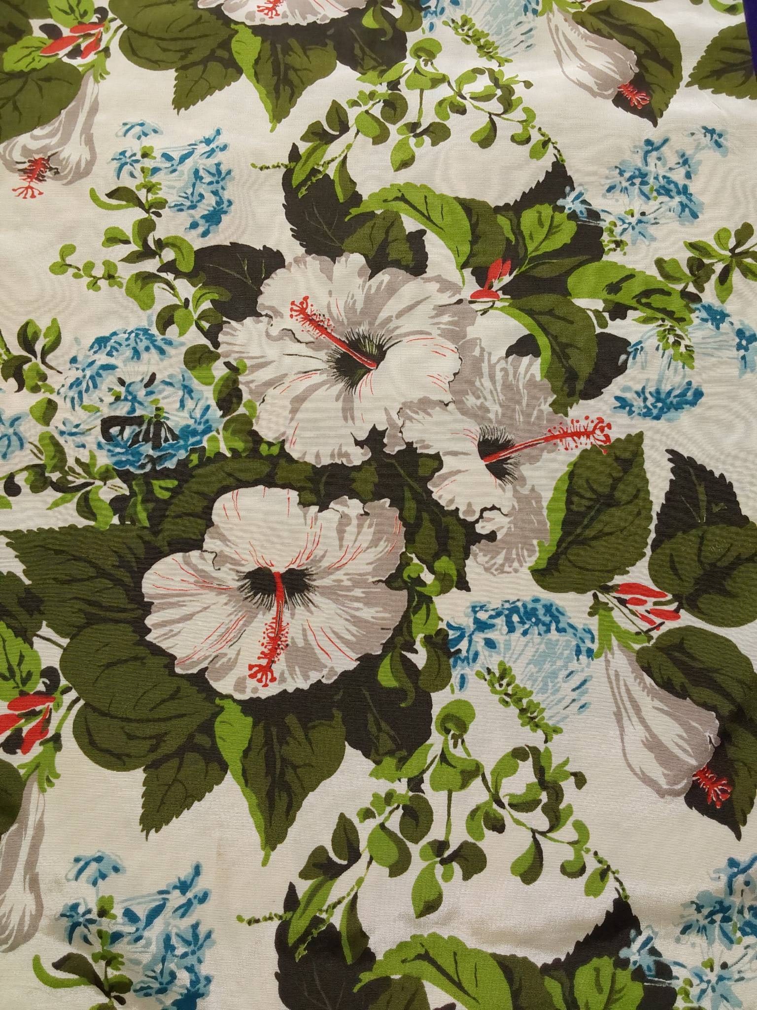 Vintage Fabric - Hibiscus and Forget - Me - Nots: Vintage white fabric measuring 46"x119" decorated with a repeating floral pattern. The design includes white hibiscus and blue forget-me-nots on a white background. Some signs of storage discoloration