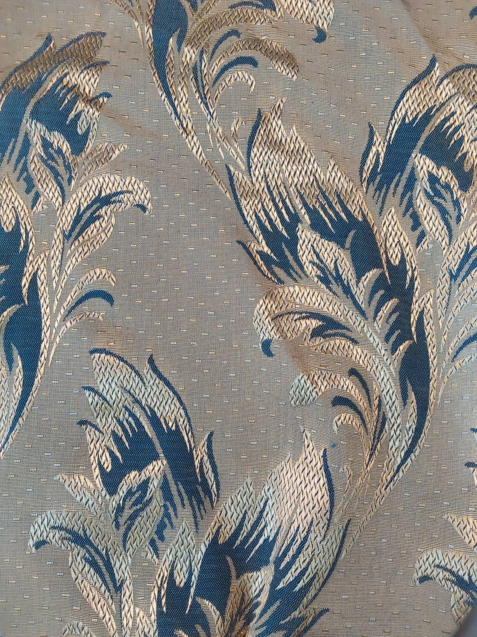 Vintage Fabric - Embroidered Blue Leaf: Vintage fabric measuring 48inx230in, featuring an embroidered blue, silver, and gold leaf design on a textured background. The fabrics size and intricate pattern make it suitable for a variety of uses
