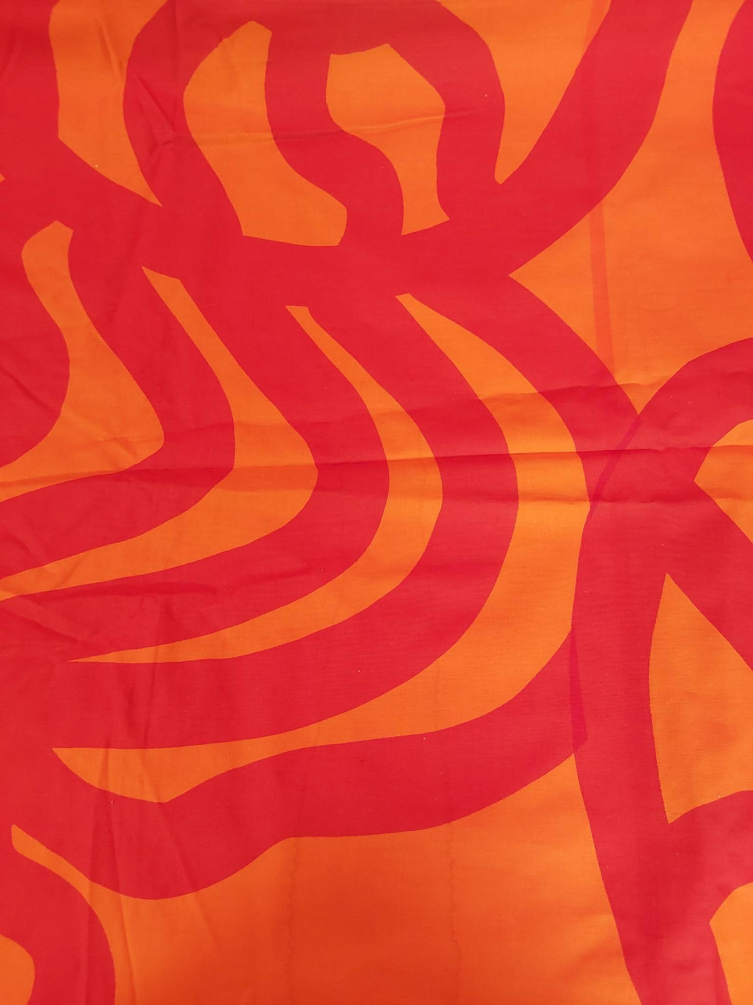 Vintage Cotton Fabric - Joonas Pattern: Vintage Marimekko fabric featuring the Joonas? pattern, designed by Maija Isola. Made of cotton, the fabric measures 54 inches by 90 inches. The design is characterized by red wheels? on an orange bac