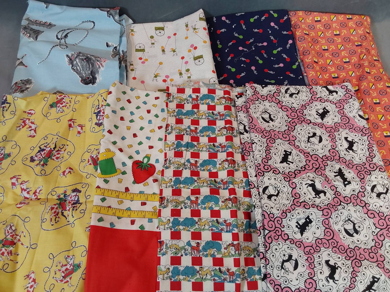 Vintage Cotton Fabric - Novelty Prints: Vintage lot of 8 pieces of cotton fabric, each with unique prints. The measurements vary, with individual pieces being 8 yards or less. Designs include themes like Western images, sewing motifs, geome