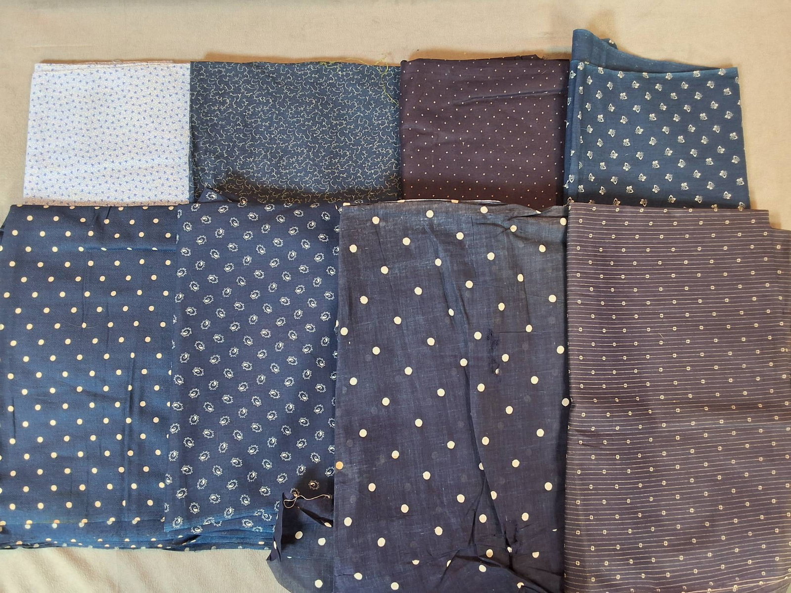 Antique Cotton Fabric - Dark Blue: A lot of eight antique cotton fabric pieces weighing 2.01 lbs. The sizes are 24in by 54in, 30in by 135in, 24in by 74in, 25.5in by 100in, 20in by 24in, 29.5in by 130in, 11in by 68in, and 29in by 114in.