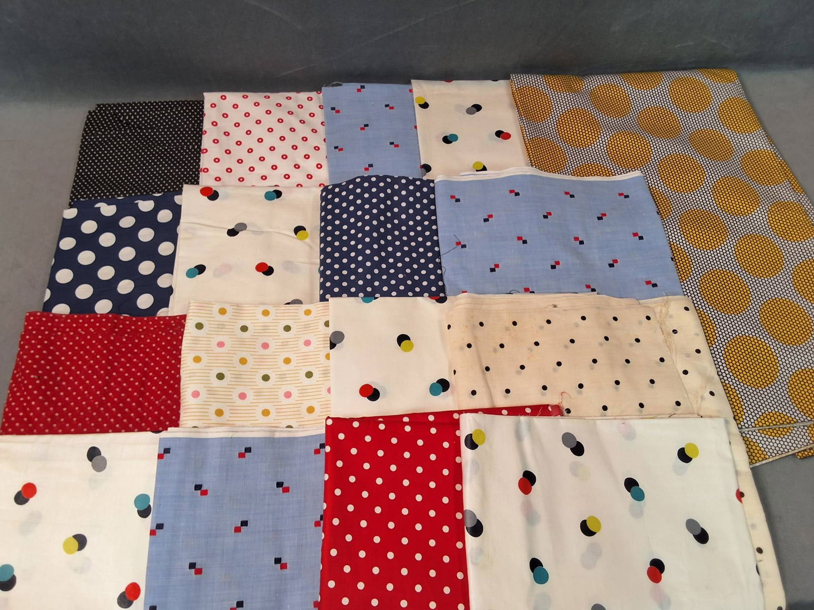 Vintage Cotton Fabric Lot - Polka Dots and Squares: Vintage cotton fabric lot featuring 17 pieces with a combined weight of 5.11 lbs and various measurements. The fabric is patterned with polka dots in an array of colors such as red, blue, yellow, blac