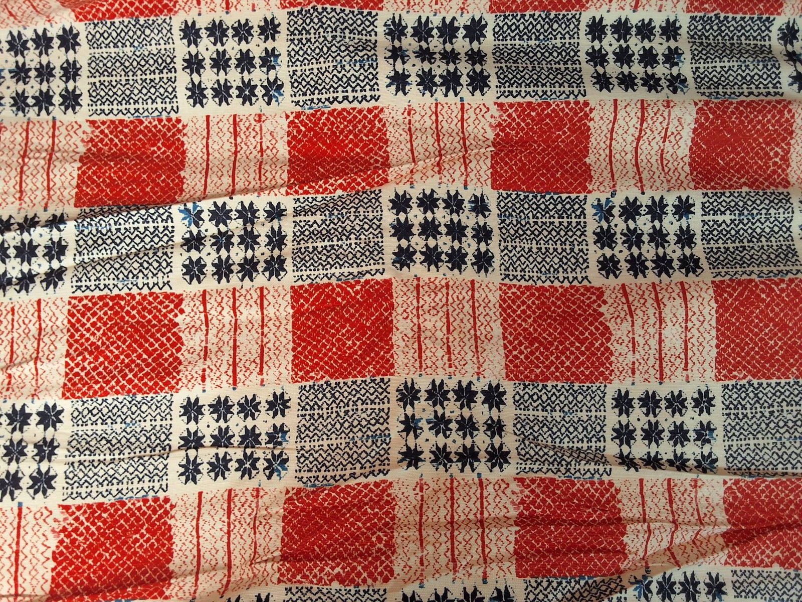 Vintage Cotton Fabric - Pioneer Sarape: Vintage cotton home deco piece titled "Pioneer Sarape" from Schumacher. Measures approximately 55"x348". The fabric features a series of red, white, and navy blue squares with various thick and thin p