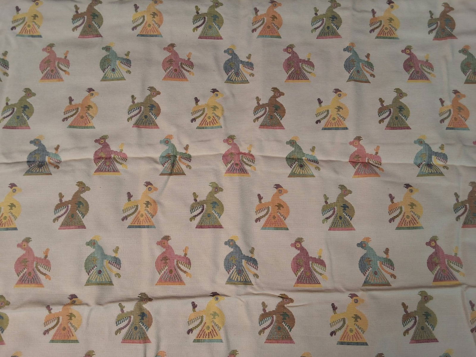 Vintage Cotton Fabric - Multicolored Birds: Vintage cotton fabric measuring 56in by 75in with a white background illustrating birds in a variety of colors. The birds are arranged in alternating directional rows, showcasing shades of orange, yel