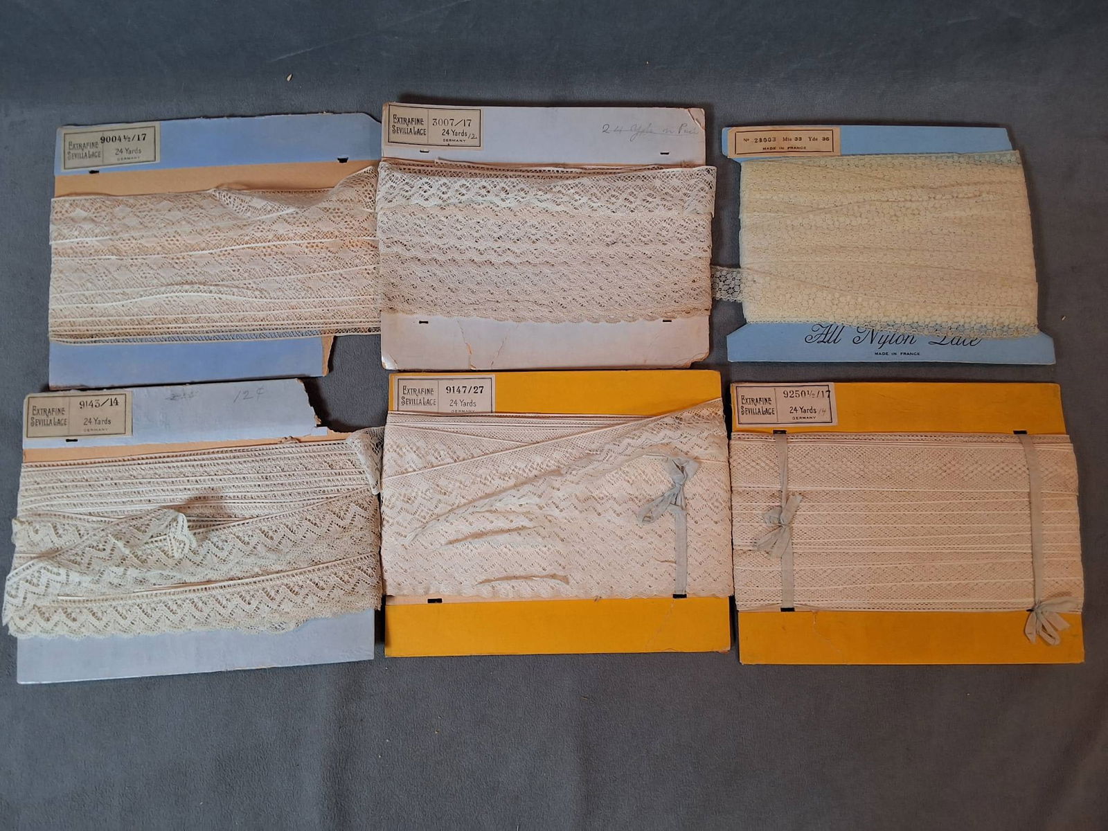 Antique Lace Trim Collection: A collection consisting of six pieces of antique lace trimmings. Five of the pieces originate from Germany, and one piece is from France. Each lace is crafted in white material and shows no signs of s