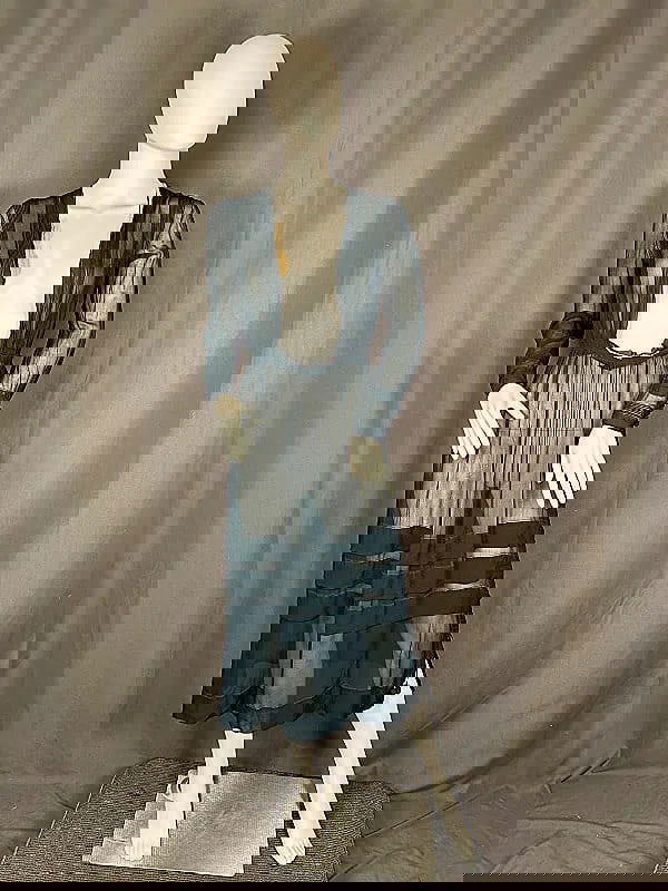 Sheer Silk Crepe Dress c1915: Sheer Silk Crepe Dress c1915. This lot includes 1 sheer teal silk crepe dress featuring vertical pickups on the bodice, sleeves, and skirt, side snap closures, dangling acorn like accents. The dress m