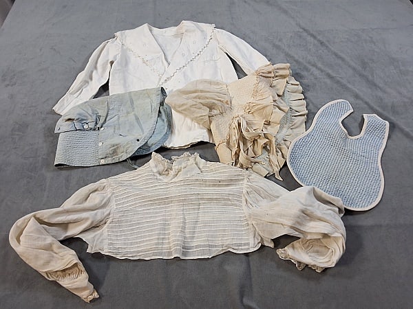 Early 20th Century Child's Clothes and Bonnets: Early 20th Century Child's Clothes and Bonnets. The lot consists of five pieces of antique children's clothes and bonnets. Featured are five antique children's clothes and bonnets from the early 20th 
